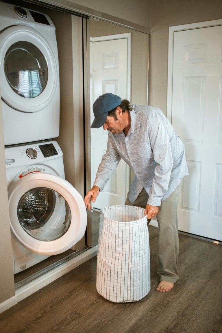 A man handling laundry in a modern